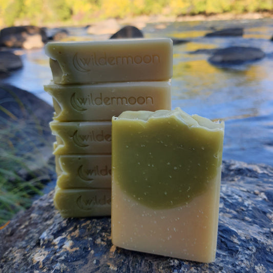high desert pinon and sagebrush artsan soap. Rectangular soap with tan bottom half and sage green top half with wildermoon logo stamp on the side.